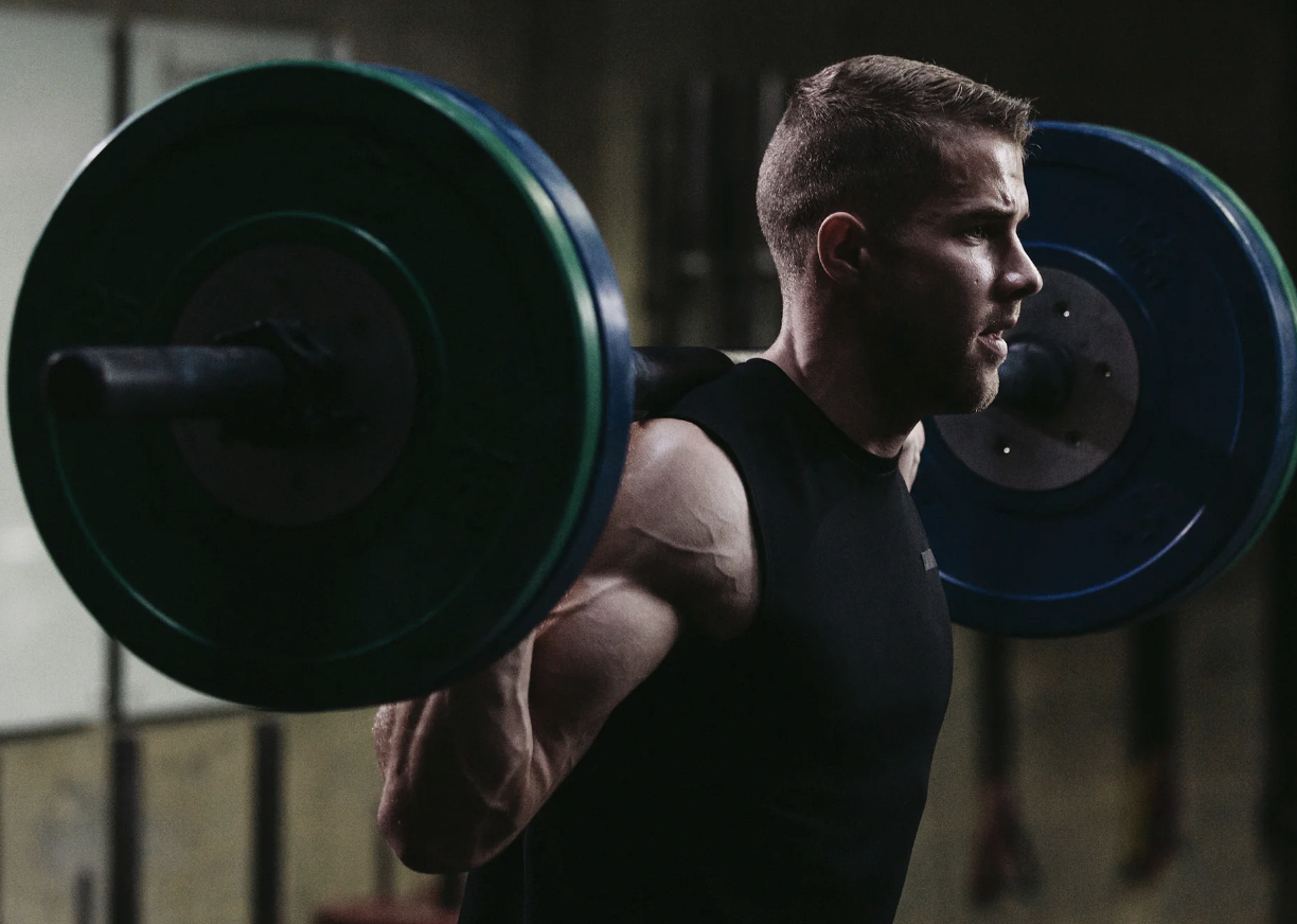 Athlete training with a loaded barbell